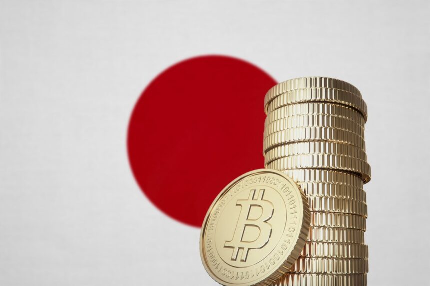 A stack of Bitcoin coins with the Japanese flag in the background.